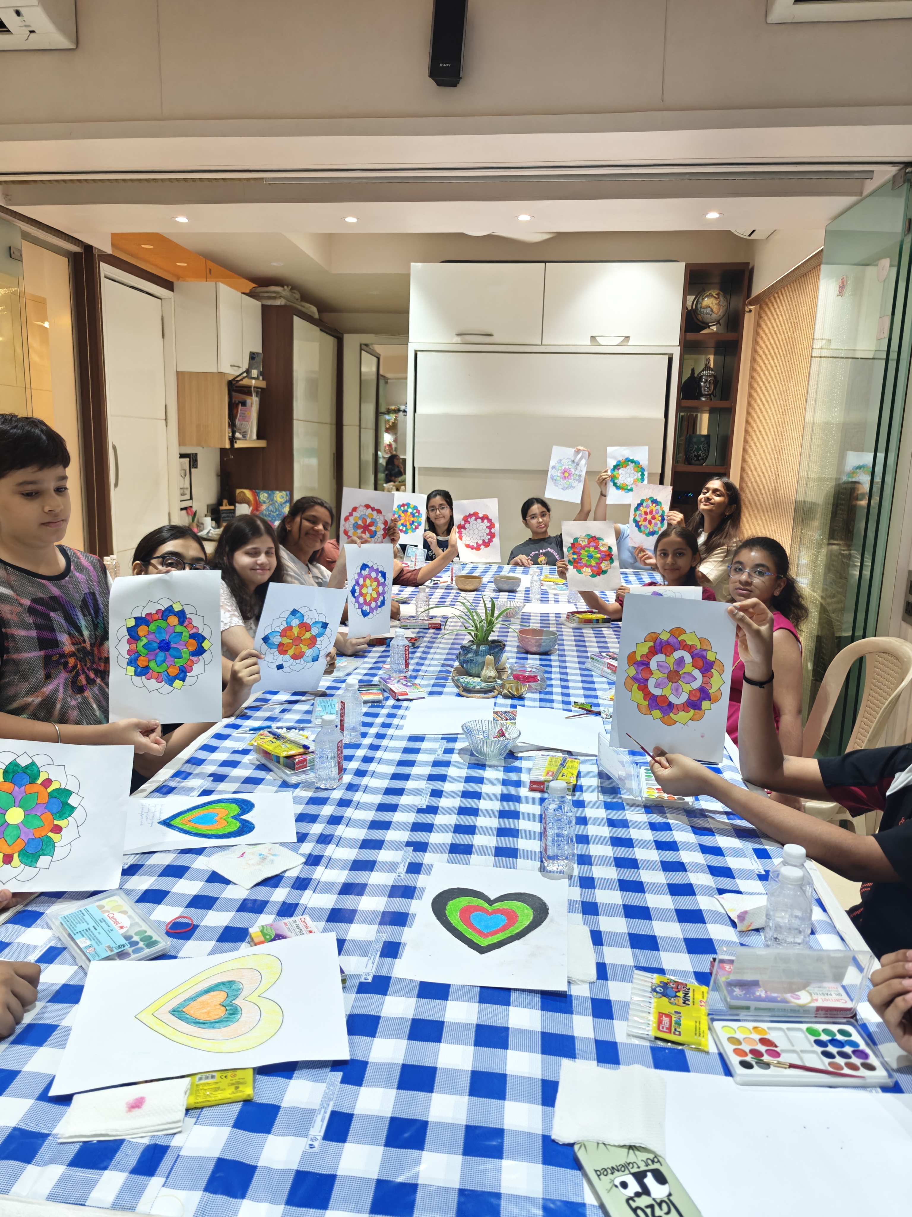 Young participants with mandala artwork