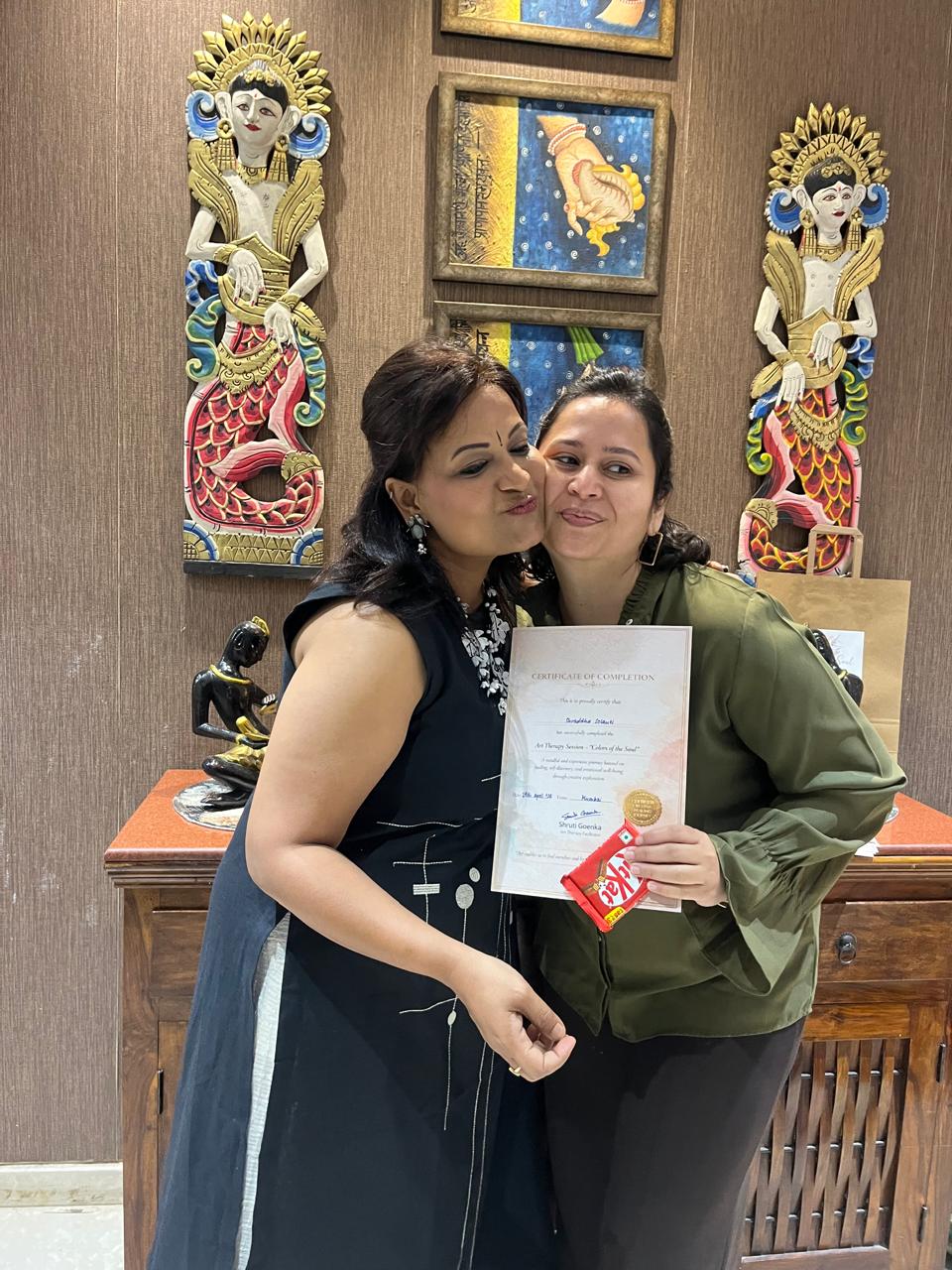 Shruti with participant receiving certificate